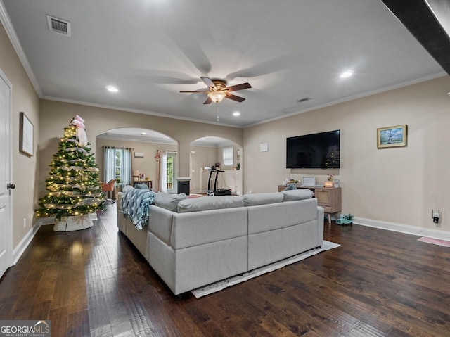 124 Belford Way, Locust Grove, GA 30233 - living room with arched walkways, ceiling fan, dark wood finished floors, recessed lighting, and crown molding