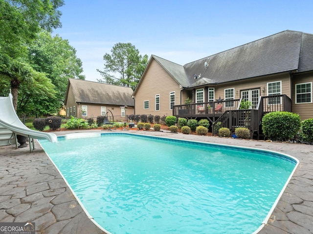 124 Belford Way, Locust Grove, GA 30233 - swimming pool with a water slide and a deck
