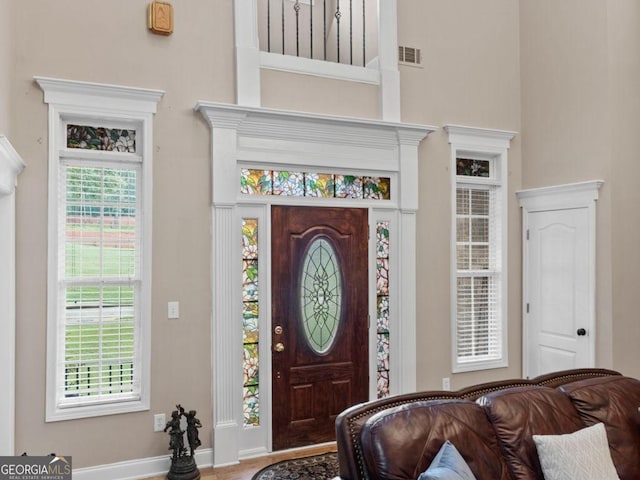 124 Belford Way, Locust Grove, GA 30233 - foyer entrance with a high ceiling and baseboards