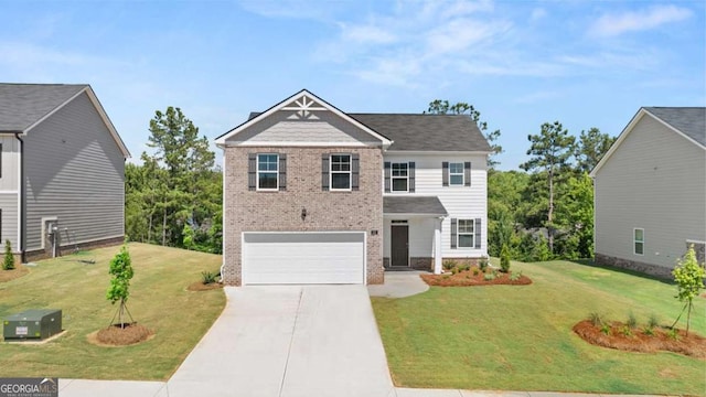 view of front of home with brick siding, an attached garage, concrete driveway, and a front yard