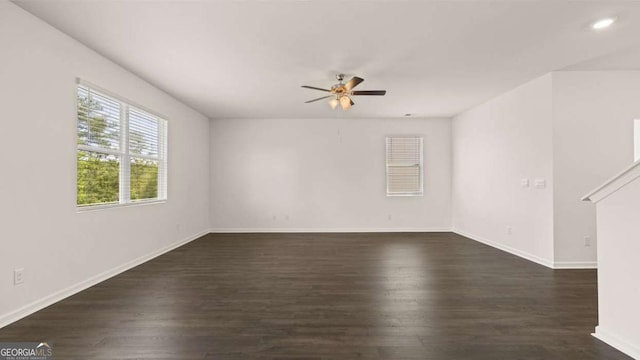 spare room featuring ceiling fan, dark wood-type flooring, baseboards, and recessed lighting