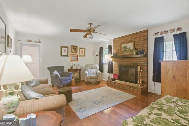 154 Willowdell Dr, Toccoa, GA 30577 - living room with a brick fireplace, ceiling fan, and wood finished floors