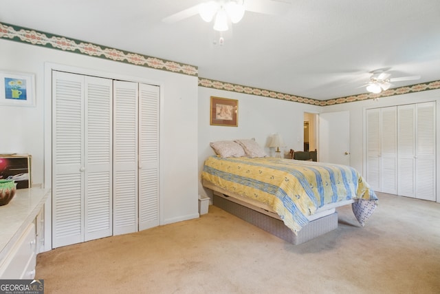 154 Willowdell Dr, Toccoa, GA 30577 - carpeted bedroom featuring ceiling fan and two closets