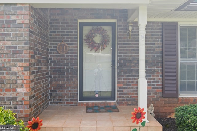 154 Willowdell Dr, Toccoa, GA 30577 - doorway to property featuring brick siding and covered porch