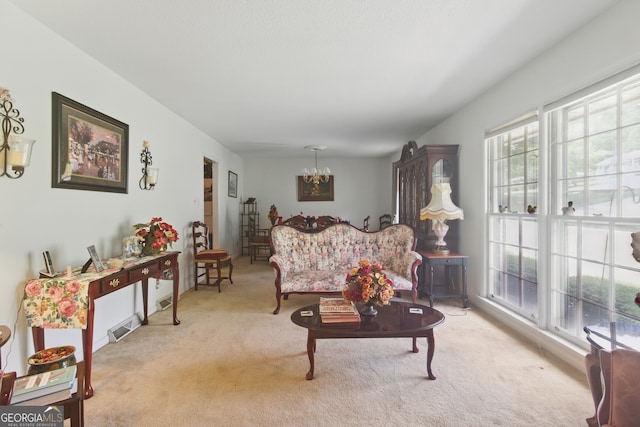 154 Willowdell Dr, Toccoa, GA 30577 - carpeted living area with a chandelier