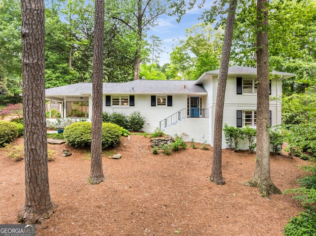 504 Kingswood Ln NW, Atlanta, GA 30305 - back of property featuring brick siding, roof with shingles, and a carport