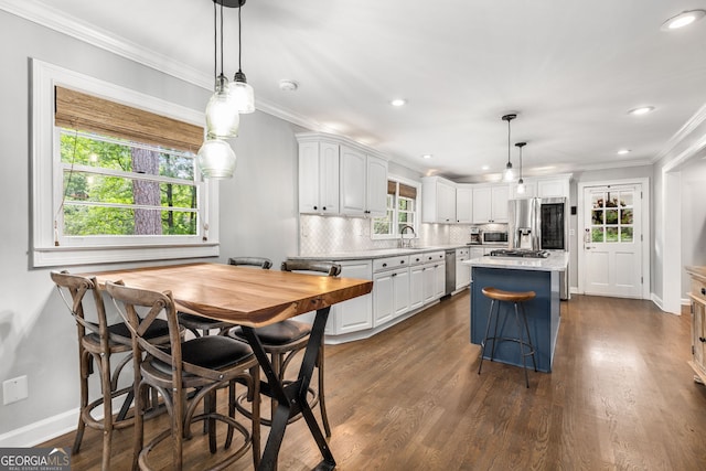 504 Kingswood Ln NW, Atlanta, GA 30305 - kitchen with white cabinetry, light countertops, decorative backsplash, appliances with stainless steel finishes, and recessed lighting