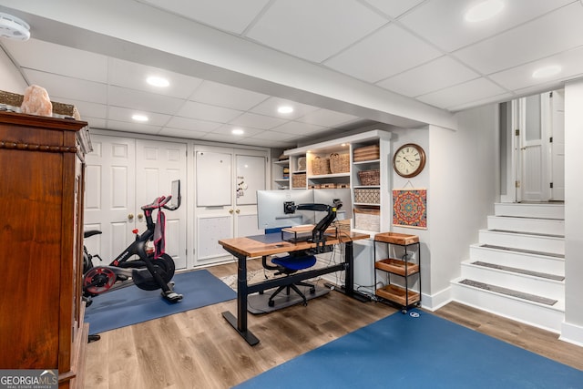 504 Kingswood Ln NW, Atlanta, GA 30305 - exercise room featuring wood finished floors, a paneled ceiling, baseboards, and recessed lighting