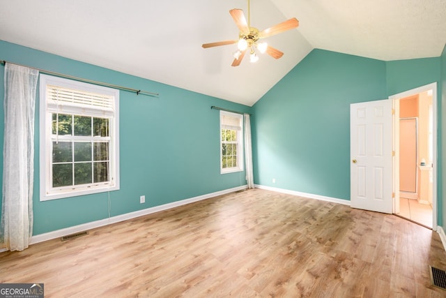 6391 Compass Dr, Flowery Branch, GA 30542 - unfurnished bedroom featuring wood finished floors, vaulted ceiling, and ceiling fan