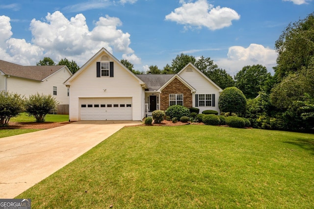 6391 Compass Dr, Flowery Branch, GA 30542 - traditional home with driveway, a garage, a front yard, and brick siding