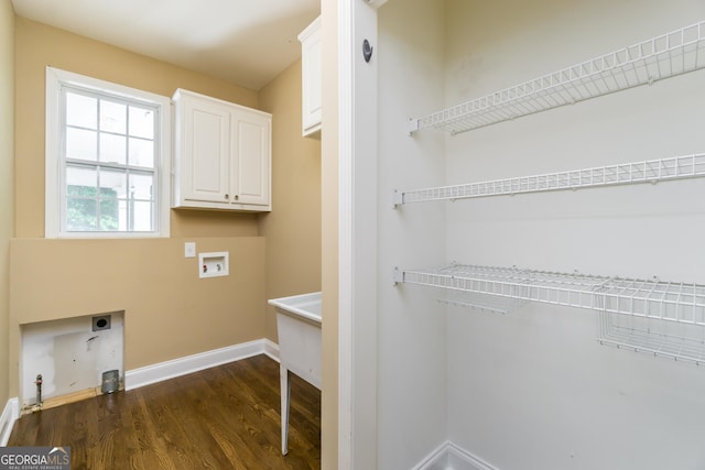 laundry room featuring hookup for an electric dryer, cabinet space, washer hookup, gas dryer hookup, and dark wood-type flooring