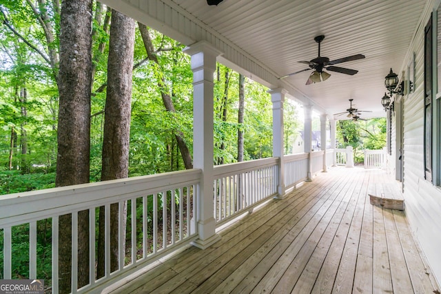 deck with ceiling fan and covered porch