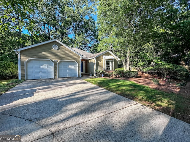 2160 Towne Manor Dr NW, Kennesaw, GA 30144 - ranch-style home featuring asphalt driveway and an attached garage