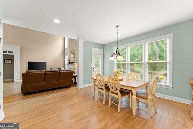 1721 Mulberry Lake Dr, Dacula, GA 30019 - dining room featuring light wood-type flooring, decorative columns, baseboards, a chandelier, and recessed lighting