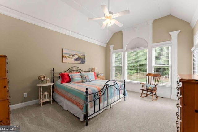 carpeted bedroom with vaulted ceiling, baseboards, ornate columns, ceiling fan, and crown molding
