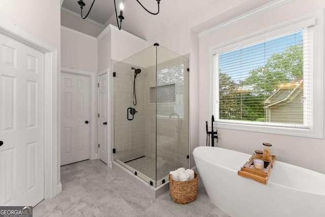 full bath with a stall shower, a freestanding bath, crown molding, and tile patterned floors