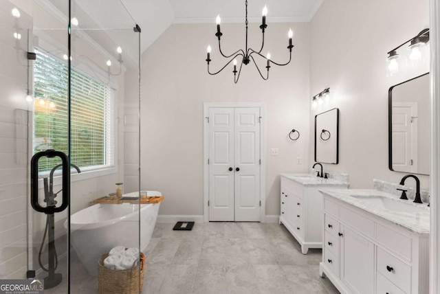 full bath with crown molding, a chandelier, two vanities, a soaking tub, and baseboards