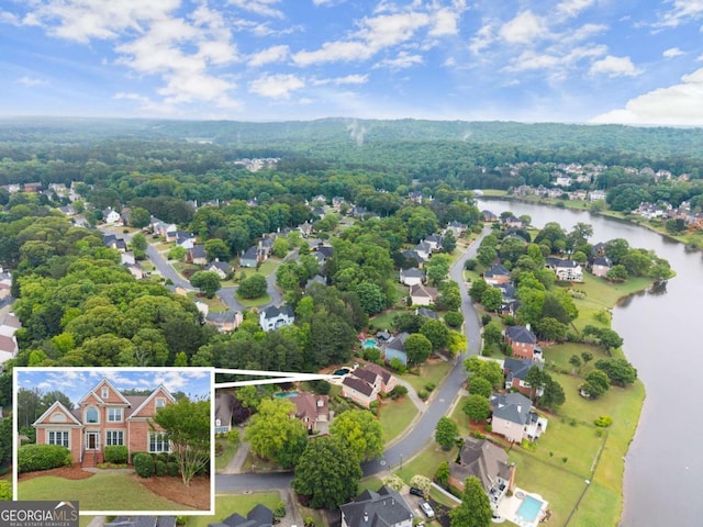 1721 Mulberry Lake Dr, Dacula, GA 30019 - aerial overview of property's location featuring a nearby body of water, property boundaries highlighted, and a heavily wooded area