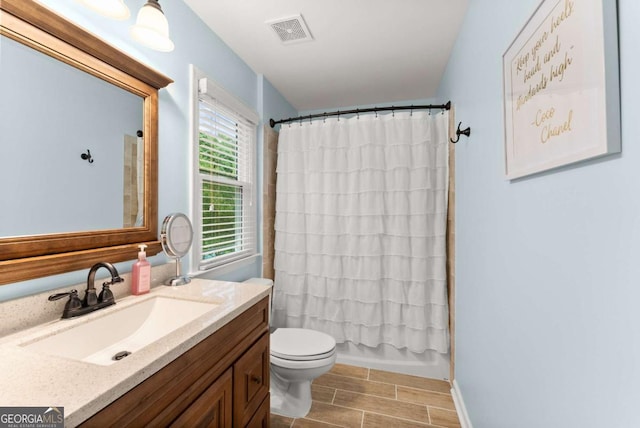 1721 Mulberry Lake Dr, Dacula, GA 30019 - full bath with toilet, vanity, and wood tiled floors