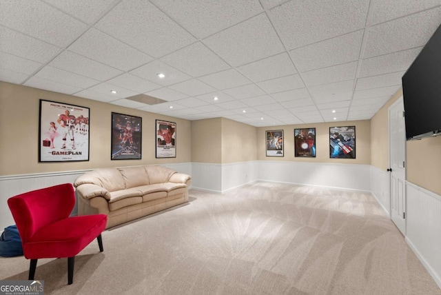 living area featuring wainscoting, carpet, a paneled ceiling, and recessed lighting