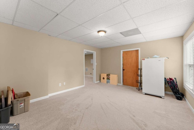 1721 Mulberry Lake Dr, Dacula, GA 30019 - basement featuring a paneled ceiling, carpet, baseboards, and freestanding refrigerator