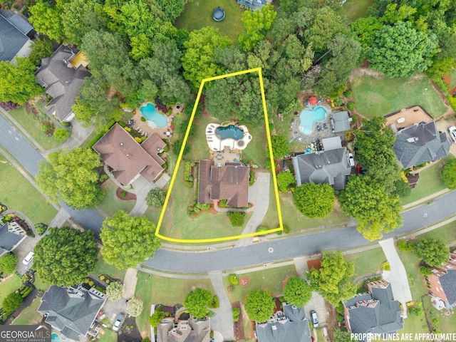 aerial view of residential area featuring a pool area and property boundaries highlighted