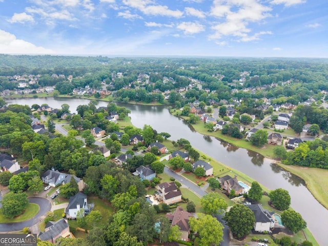 aerial perspective of suburban area with a large body of water