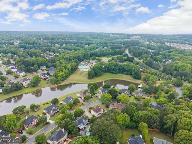 aerial perspective of suburban area with a nearby body of water