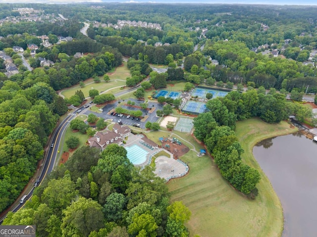 aerial view of property and surrounding area featuring a nearby body of water