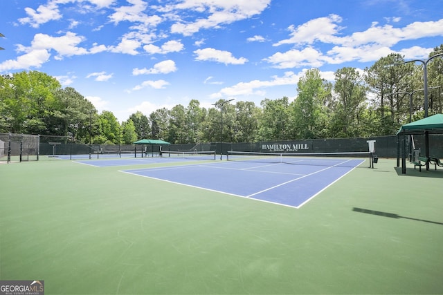 1721 Mulberry Lake Dr, Dacula, GA 30019 - view of tennis court with community basketball court and view of scattered trees
