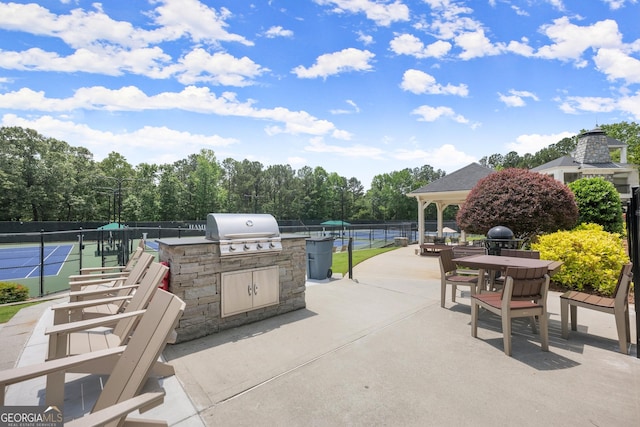 1721 Mulberry Lake Dr, Dacula, GA 30019 - view of patio / terrace with a tennis court, a gazebo, and outdoor dining space