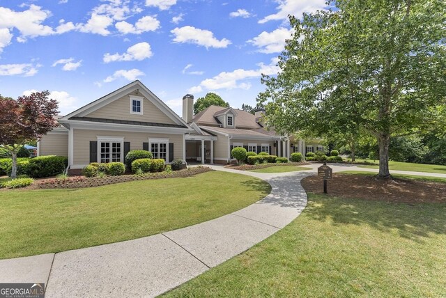 1721 Mulberry Lake Dr, Dacula, GA 30019 - view of front facade featuring a front lawn and a chimney