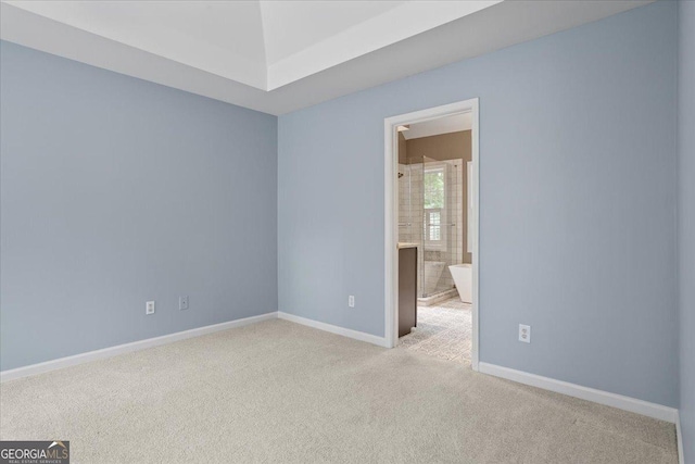 empty room with carpet and baseboards
