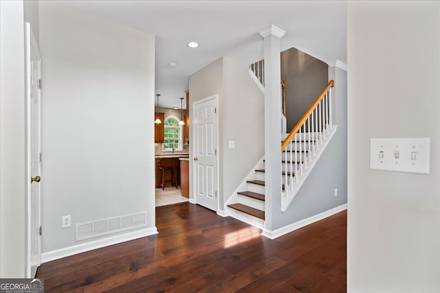 stairs featuring hardwood / wood-style flooring, recessed lighting, and baseboards
