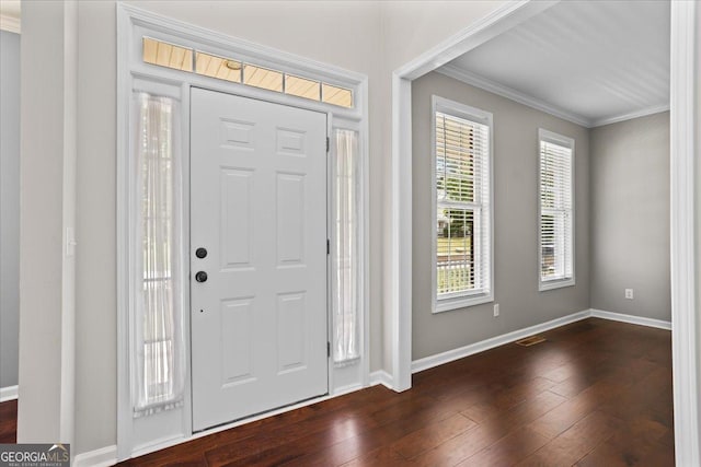 entrance foyer featuring crown molding, baseboards, and dark wood-style flooring