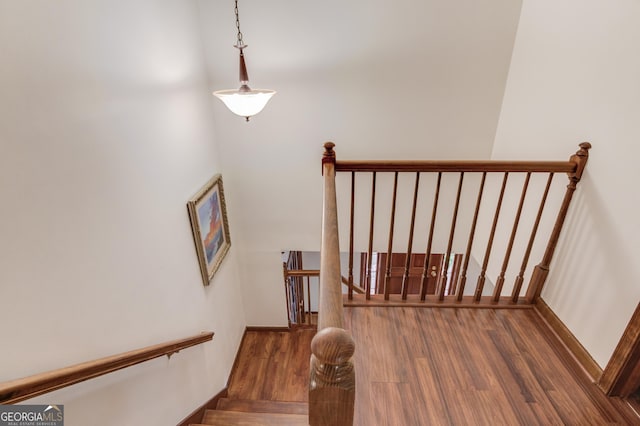 3741 Windhurst Dr SW, Lilburn, GA 30047 - stairs featuring wood finished floors
