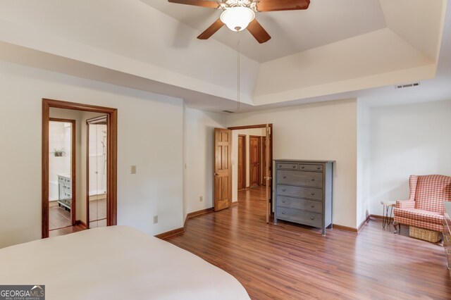 3741 Windhurst Dr SW, Lilburn, GA 30047 - bedroom featuring wood finished floors, baseboards, ceiling fan, and a raised ceiling