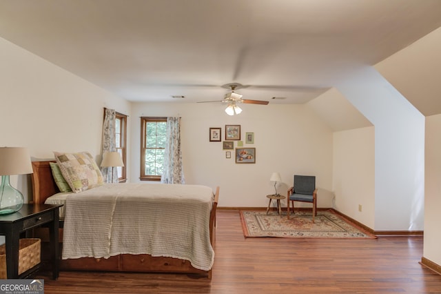3741 Windhurst Dr SW, Lilburn, GA 30047 - bedroom with wood finished floors, lofted ceiling, and baseboards