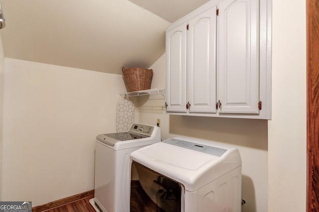 3741 Windhurst Dr SW, Lilburn, GA 30047 - laundry area with washer and clothes dryer, cabinet space, dark wood-type flooring, and baseboards