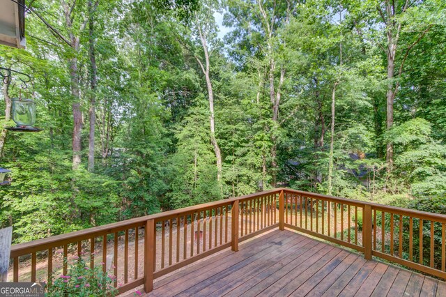 3741 Windhurst Dr SW, Lilburn, GA 30047 - wooden terrace with a wooded view