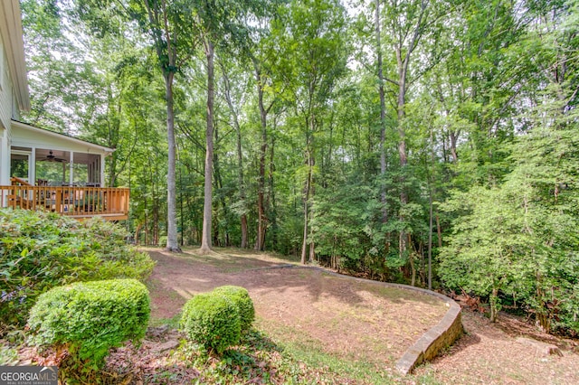 3741 Windhurst Dr SW, Lilburn, GA 30047 - view of yard with ceiling fan and a wooden deck