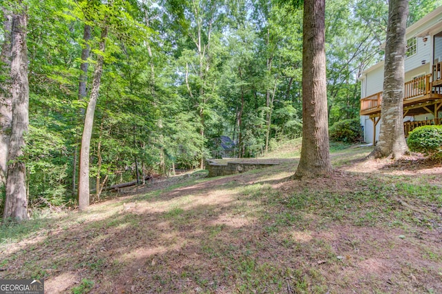 3741 Windhurst Dr SW, Lilburn, GA 30047 - view of yard with a wooden deck