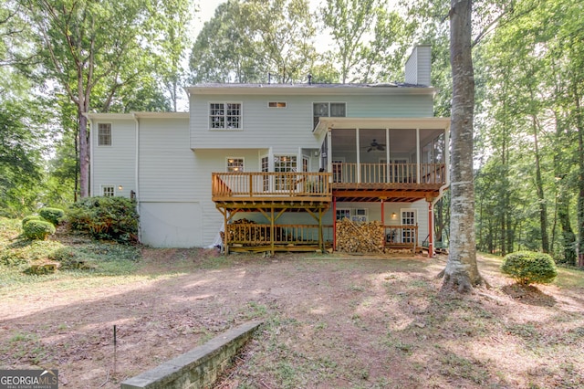 3741 Windhurst Dr SW, Lilburn, GA 30047 - rear view of property with a deck, a ceiling fan, a chimney, and a sunroom