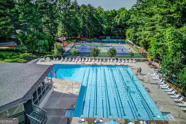 3741 Windhurst Dr SW, Lilburn, GA 30047 - community pool featuring fence and a patio