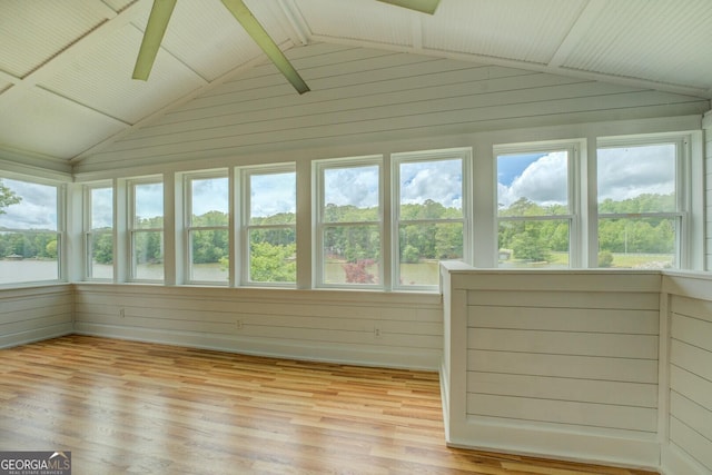 22 Waters Bridge Cir, Covington, GA 30014 - unfurnished sunroom featuring vaulted ceiling, wood finished floors, and wood walls