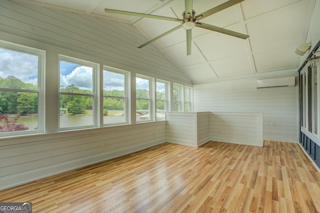 22 Waters Bridge Cir, Covington, GA 30014 - unfurnished sunroom with wooden walls, wood finished floors, plenty of natural light, a wall mounted AC, and vaulted ceiling
