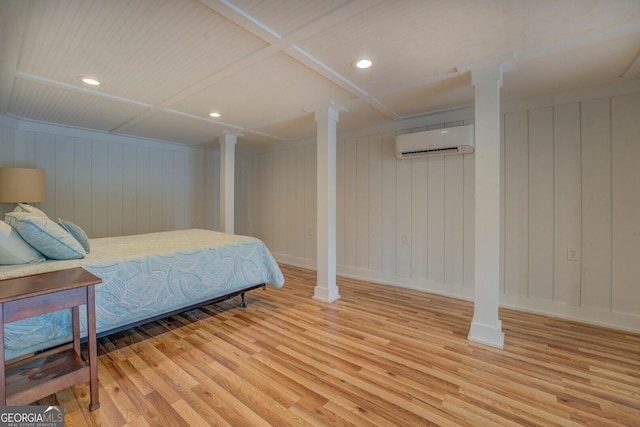 22 Waters Bridge Cir, Covington, GA 30014 - bedroom with a wall unit AC, wood finished floors, recessed lighting, and baseboards