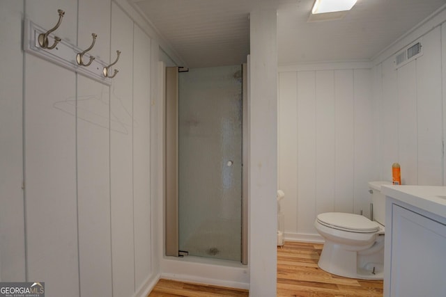22 Waters Bridge Cir, Covington, GA 30014 - full bathroom with a shower stall, vanity, wood finished floors, and toilet