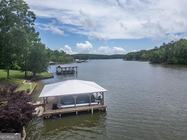 22 Waters Bridge Cir, Covington, GA 30014 - dock area with boat lift and a water view