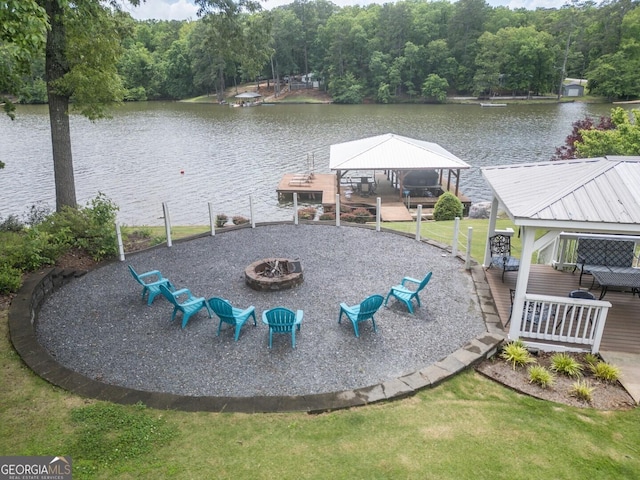 22 Waters Bridge Cir, Covington, GA 30014 - dock area featuring a gazebo, a fire pit, a water view, a wooded view, and a lawn